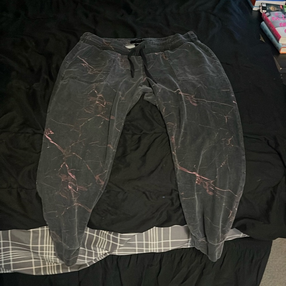 Torrid size 1 black sweatpants with purple/pink/red streaks throughout